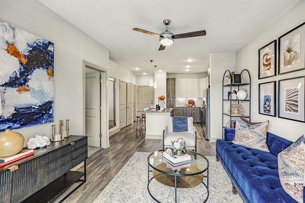 Spacious living room with contemporary decor at Domain Town Center Apartments