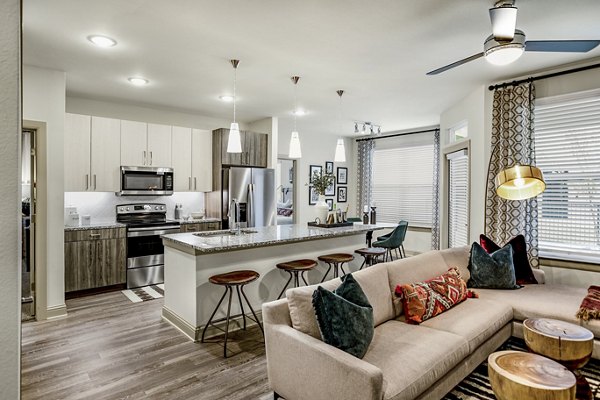 Spacious living room with modern furnishings in Domain Town Center Apartments