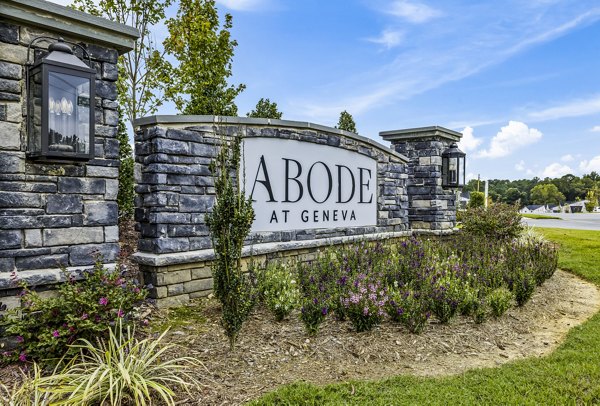 Stone sign for Abode at Geneva surrounded by vibrant landscaping in upscale community