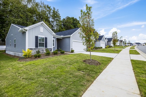 building/townhome exterior at Abode at Geneva Apartment Townhomes