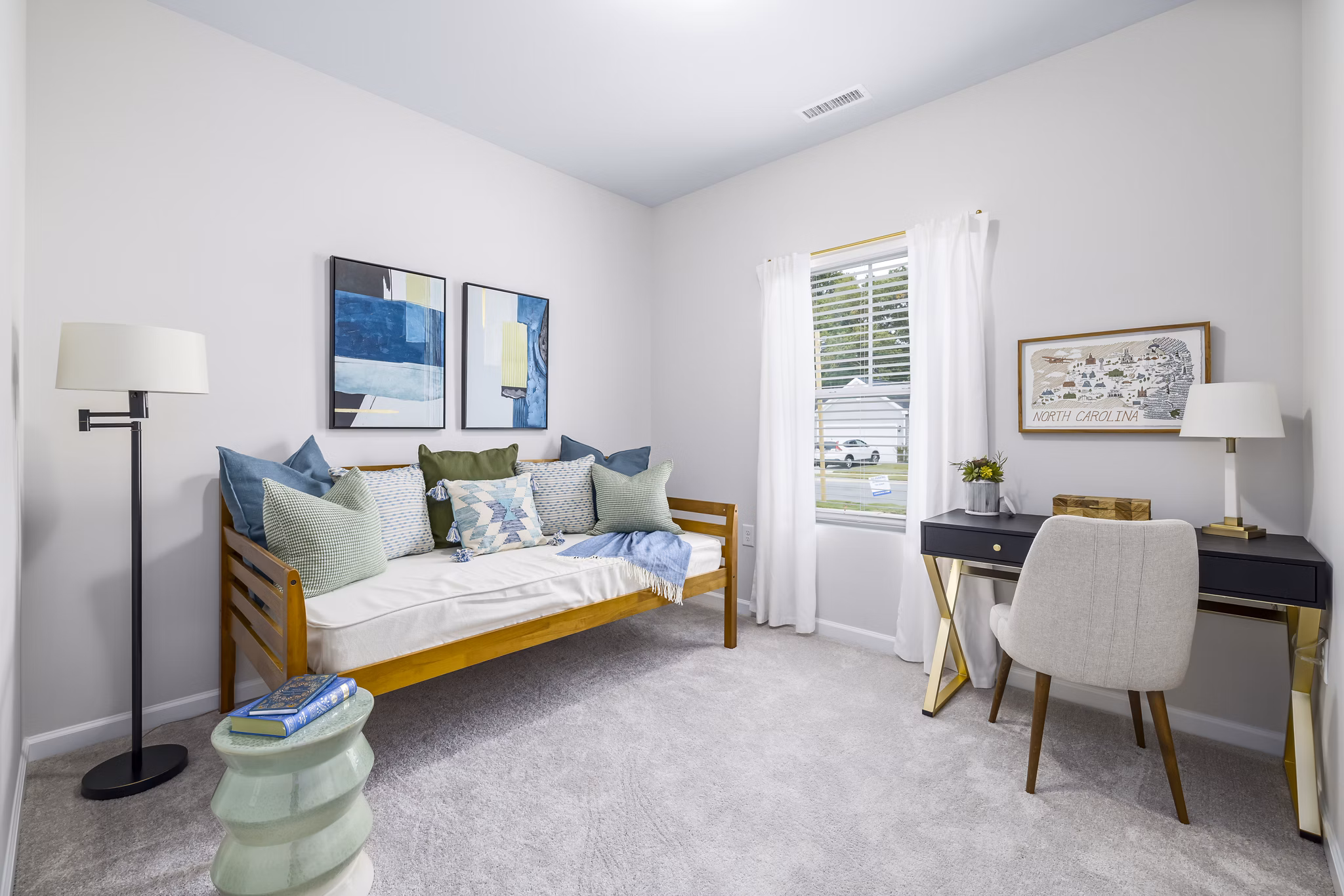 Cozy bedroom with modern furnishings at Abode at Geneva Apartment Townhomes