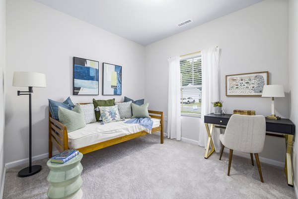 Cozy bedroom with modern furnishings at Abode at Geneva Apartment Townhomes