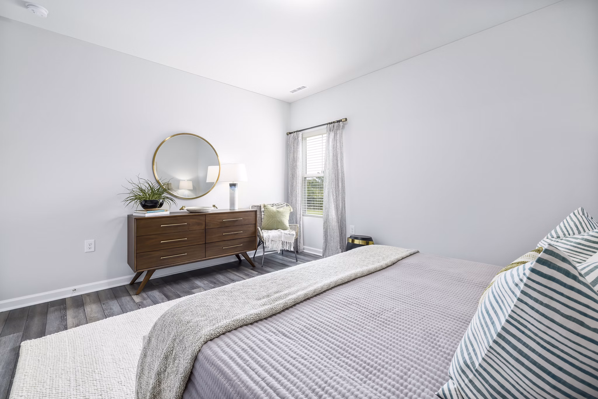 Cozy bedroom with modern decor in Abode at Geneva Apartment Townhomes