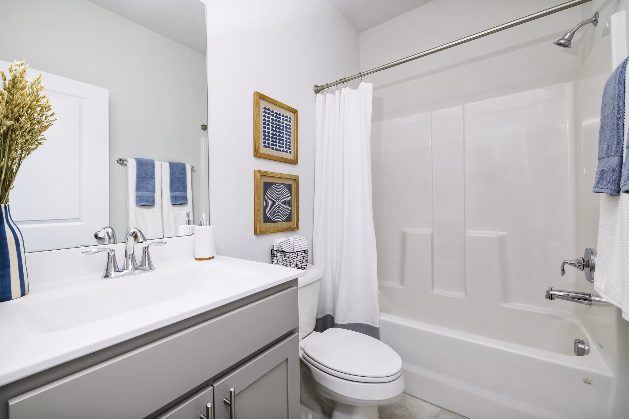 Spacious bathroom with elegant fixtures in Abode at Geneva Apartment Townhomes