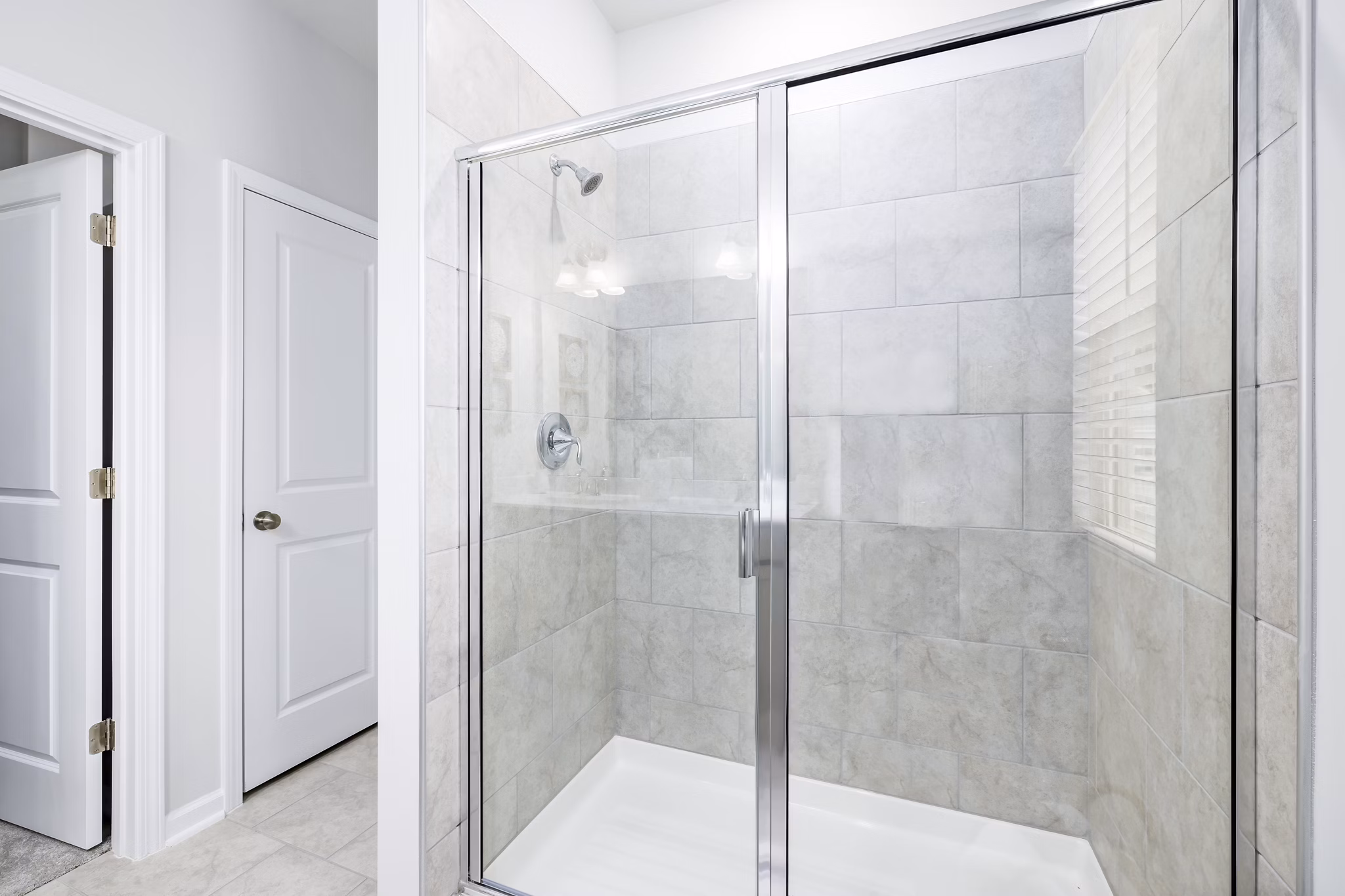 Modern bathroom with sleek fixtures at Abode at Geneva Apartment Townhomes