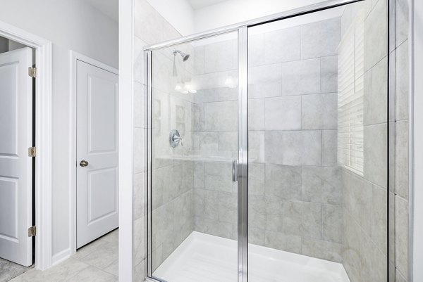 Modern bathroom with sleek fixtures at Abode at Geneva Apartment Townhomes