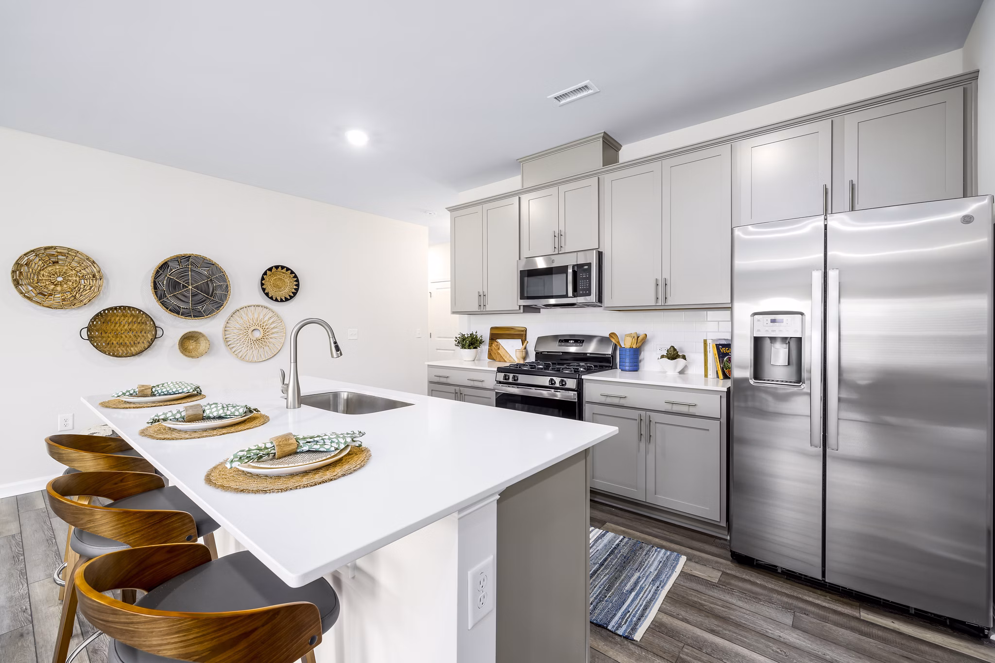 Kitchen featuring sleek countertops and stainless steel appliances at Abode at Geneva Apartment Townhomes