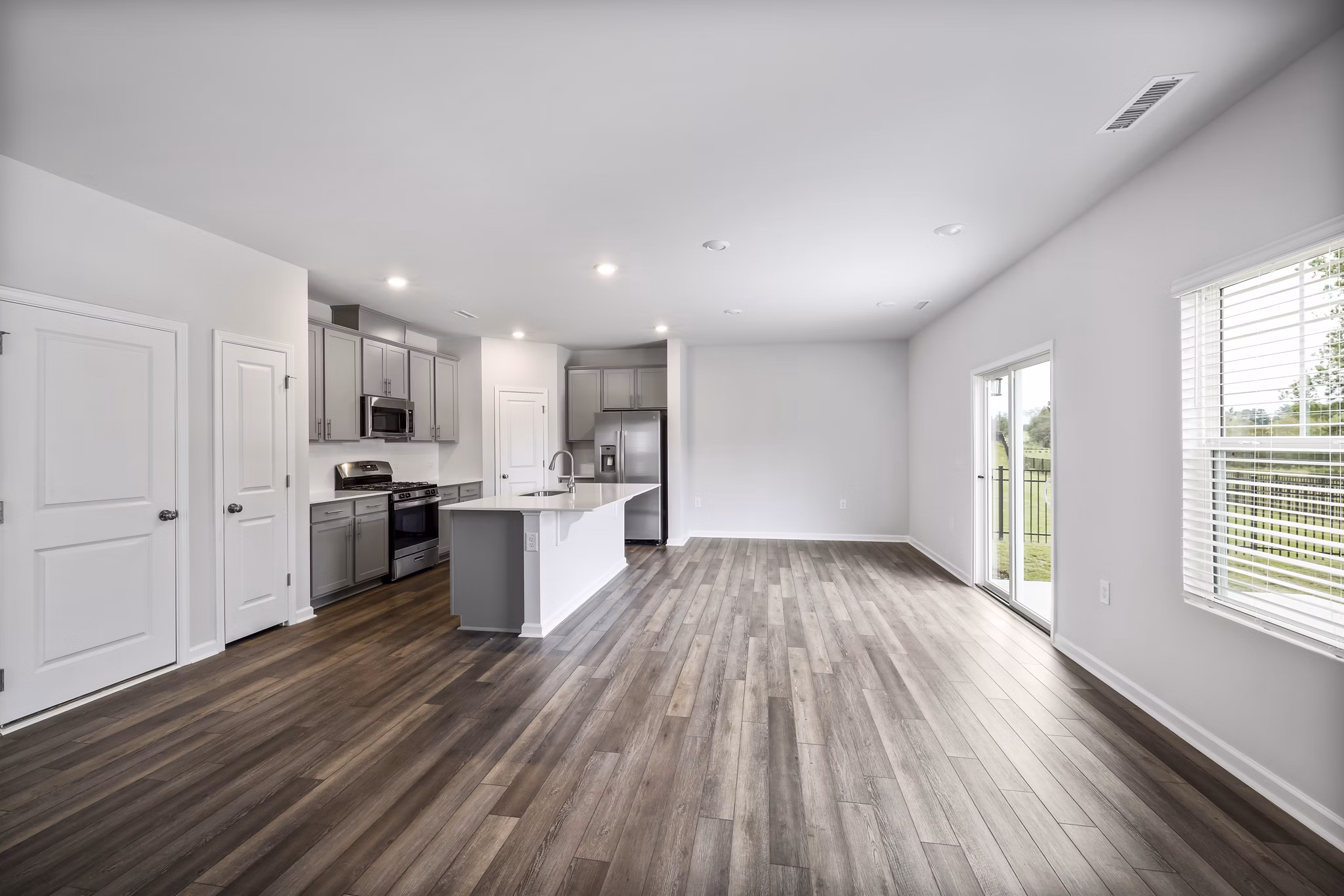 Spacious living room featuring modern furnishings at Abode at Geneva Apartment Townhomes