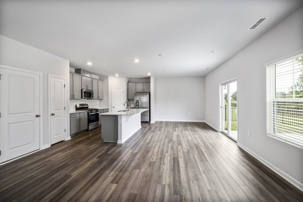 living room at Abode at Geneva Apartment Townhomes