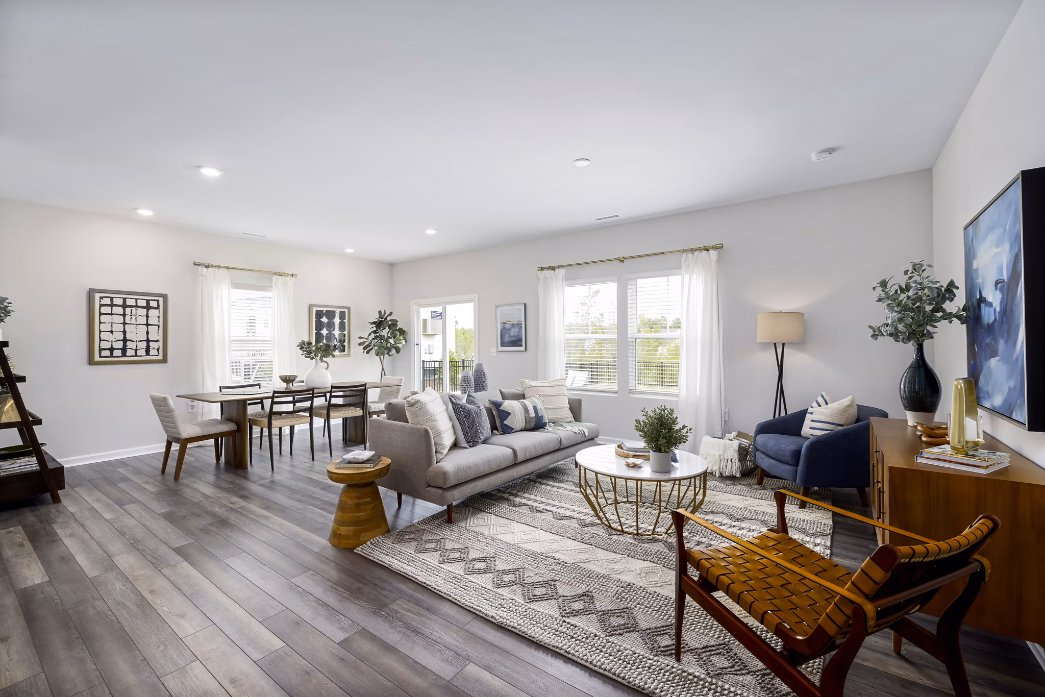 Modern living room with stylish decor at Abode at Geneva Apartment Townhomes, offering a luxurious space for relaxation and entertaining