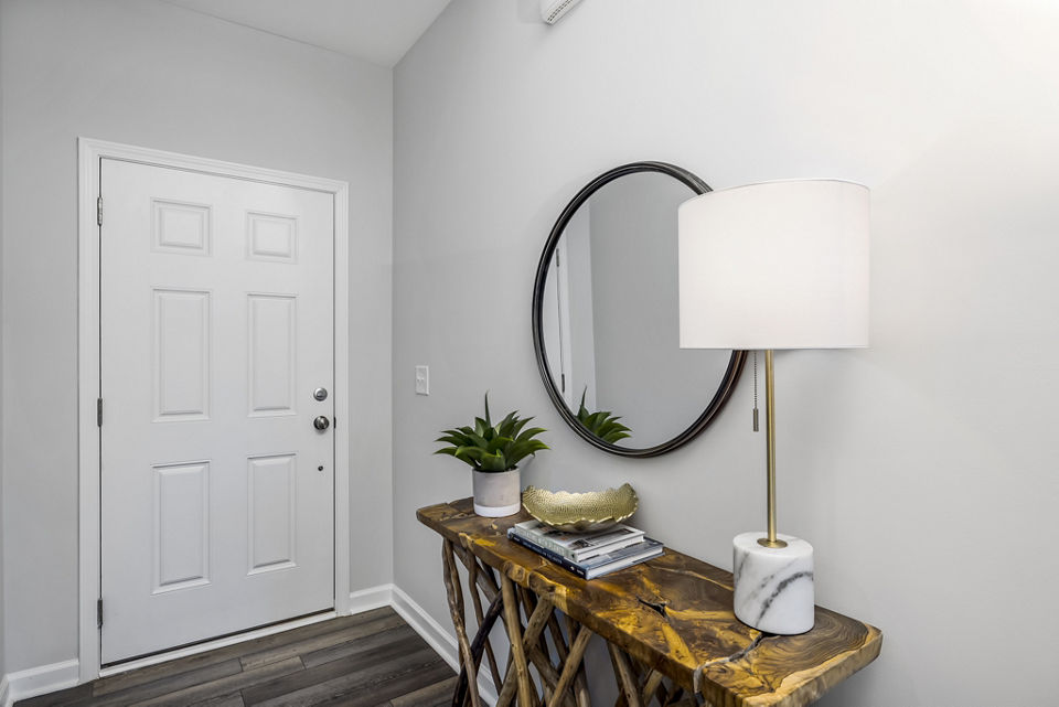 Elegant hallway with stylish decor at Abode at Geneva Apartment Townhomes entrance