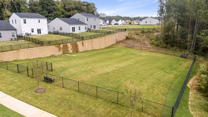 Dog park with agility equipment at Abode at Geneva Apartment Townhomes provides a playful space for pets and residents to enjoy outdoor activities