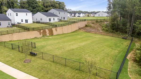 Dog park with agility equipment at Abode at Geneva Apartment Townhomes provides a playful space for pets and residents to enjoy outdoor activities
