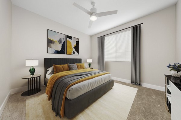 Bedroom with modern decor and large windows at Album Cooley Station Apartments