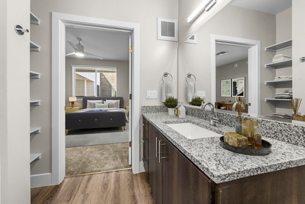 Modern bathroom with sleek design at Album Cooley Station Apartments, featuring luxury finishes and spacious layout in prime location