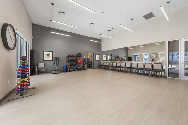 Spacious fitness center with modern equipment at Album Cooley Station Apartments, ideal for active residents seeking wellness