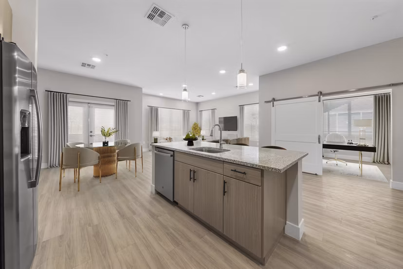 Kraft kitchen with modern appliances at Album Cooley Station Apartments, offering luxury living