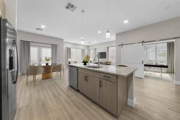 Kraft kitchen with modern appliances at Album Cooley Station Apartments, offering luxury living