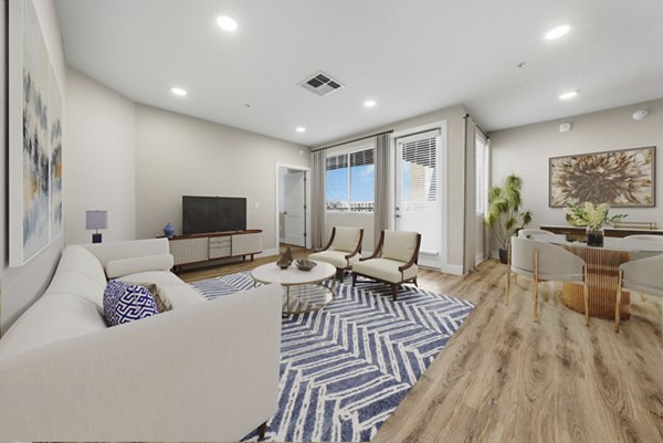 Spacious living room with modern decor in Album Cooley Station Apartments, a luxury Greystar property in a prime location