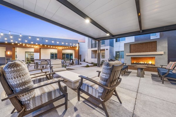 Cozy fire pit on patio at Album Cooley Station Apartments, perfect for evening gatherings