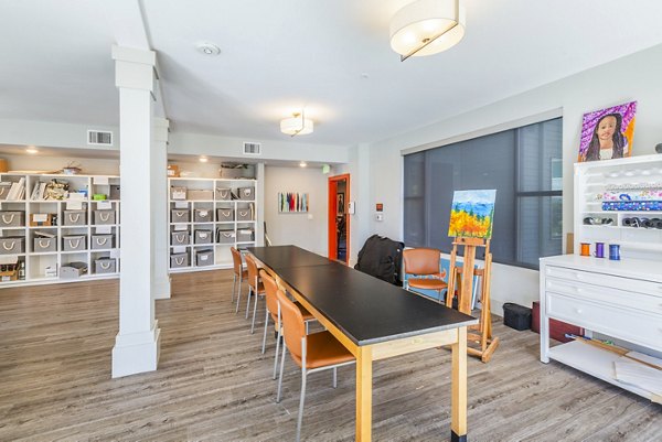 Clubhouse art room with vibrant murals and creative spaces at Solana Lakewood Apartments in Greystar luxury community