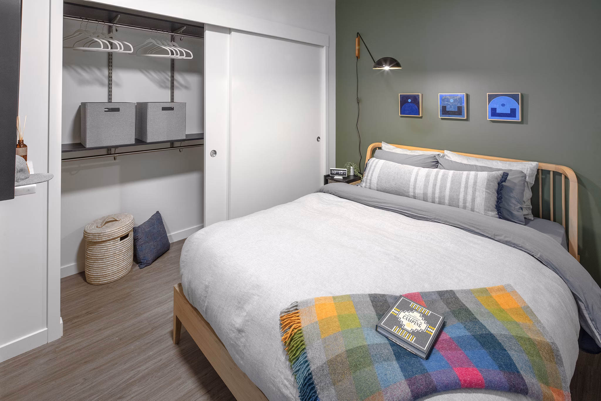 Spacious bedroom with modern decor and ample natural light at Sawbuck Apartments