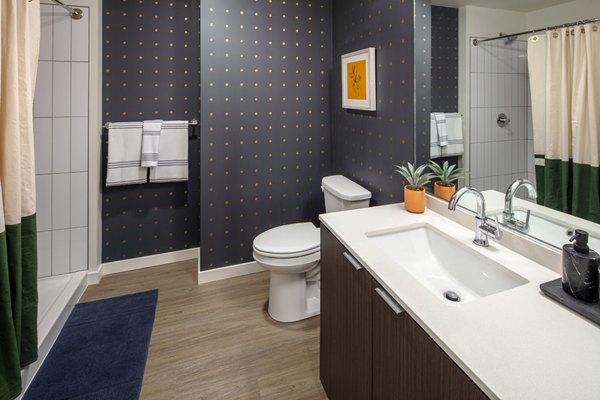 Elegant bathroom with modern fixtures at Sawbuck Apartments