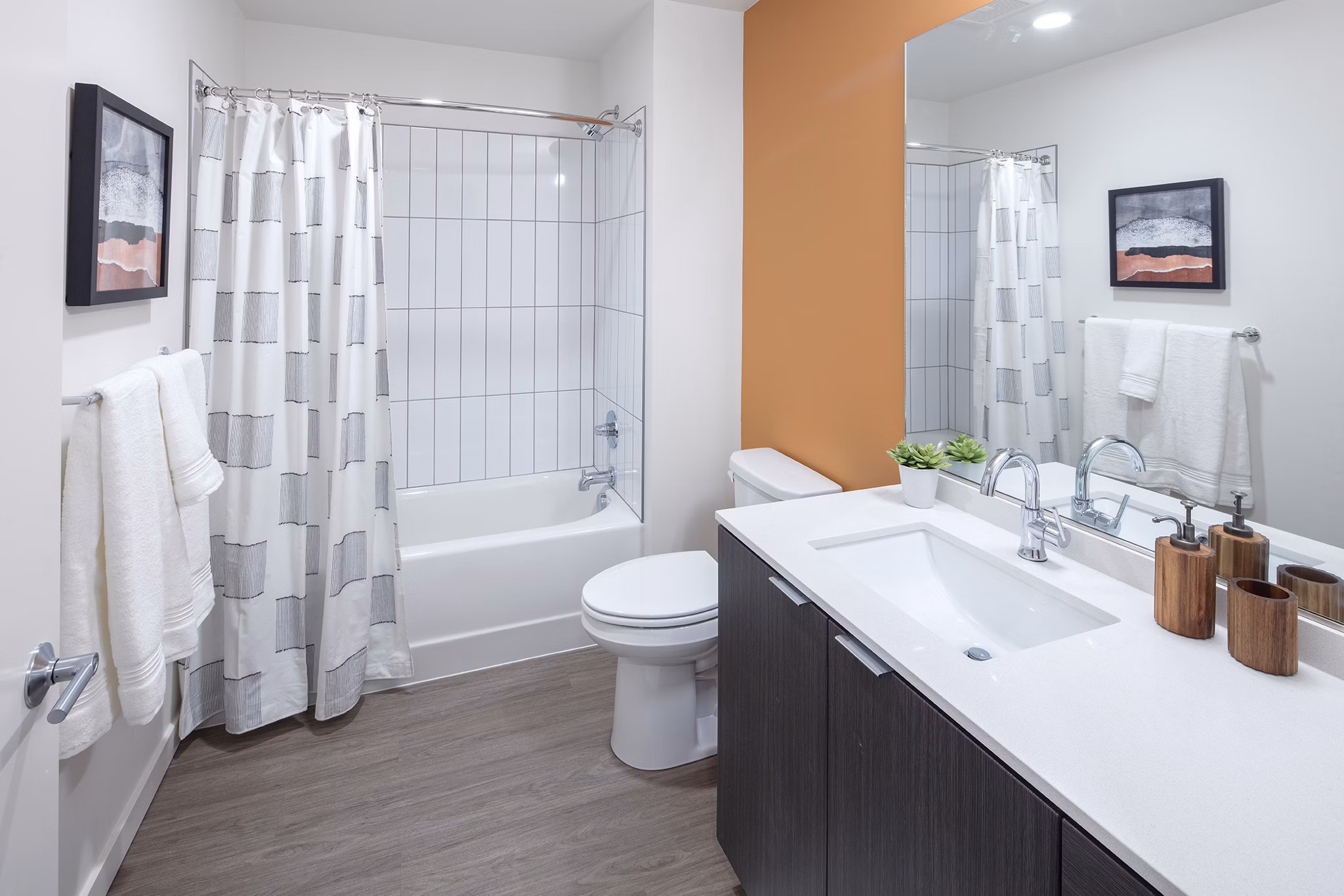 Bathroom featuring modern design elements at Sawbuck Apartments