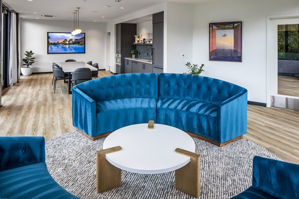 Sawbuck Apartments: Elegant clubhouse featuring modern design and comfortable seating areas perfect for socializing and relaxation