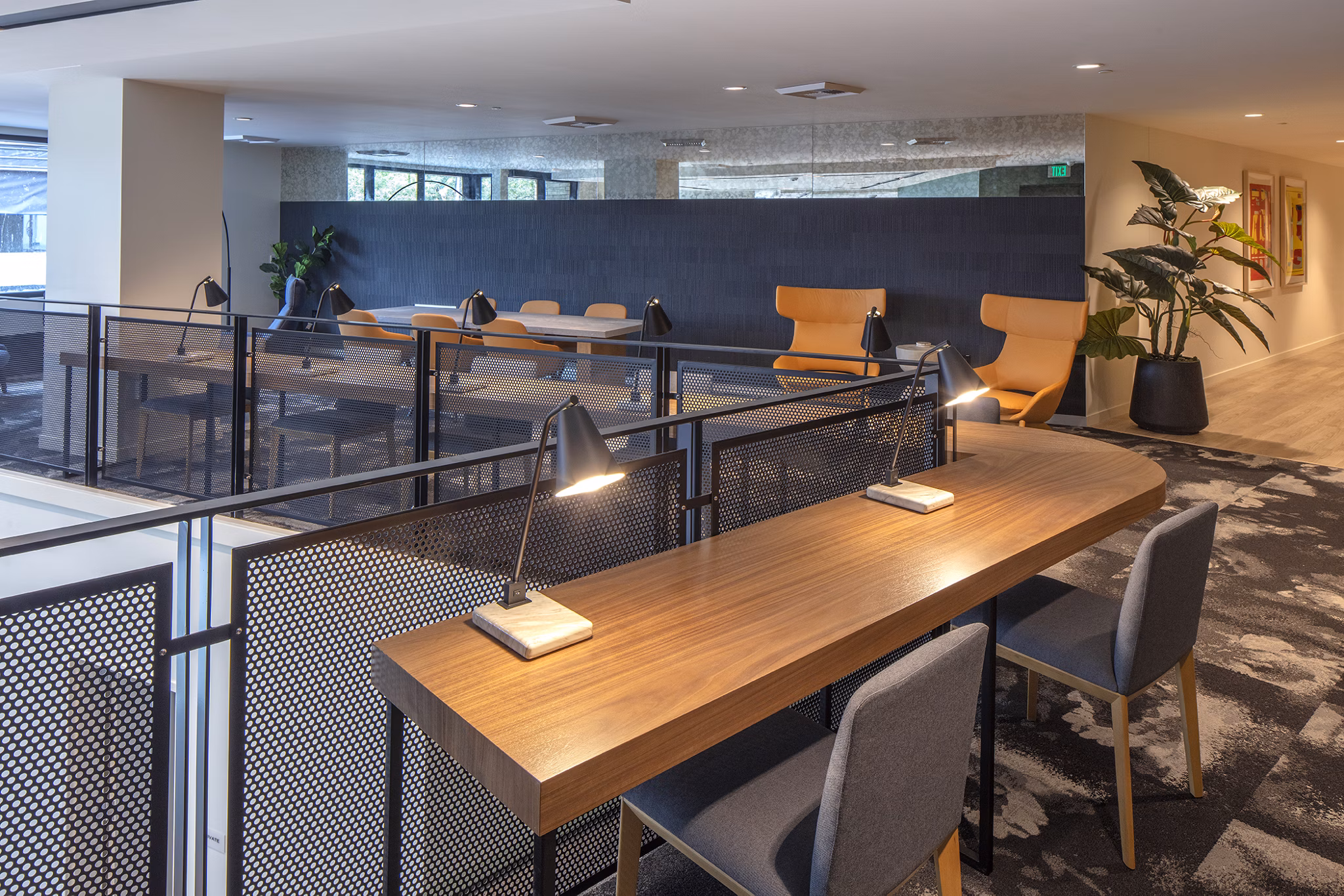 Modern clubhouse with seating and entertainment areas at Sawbuck Apartments, offering luxurious amenities and community spaces