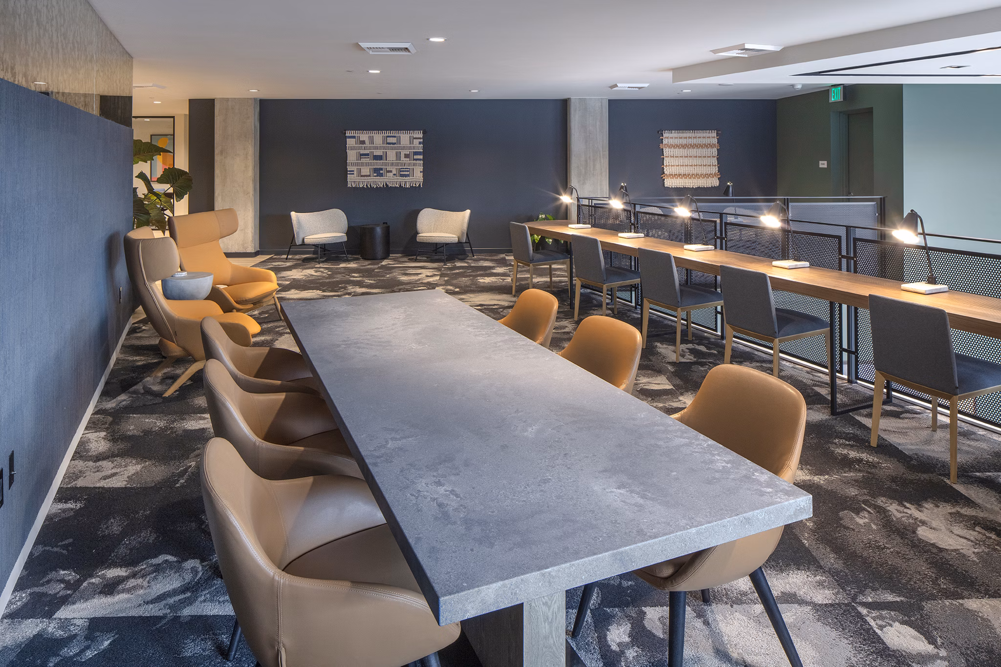 Meeting facility with modern seating and conference setup at Sawbuck Apartments, ideal for hosting events and collaborative workspaces
