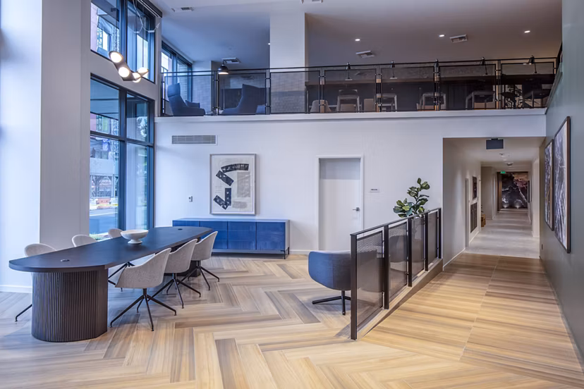 Sawbuck Apartments: Modern clubhouse/lobby with contemporary design and seating areas, ideal for relaxing and socializing