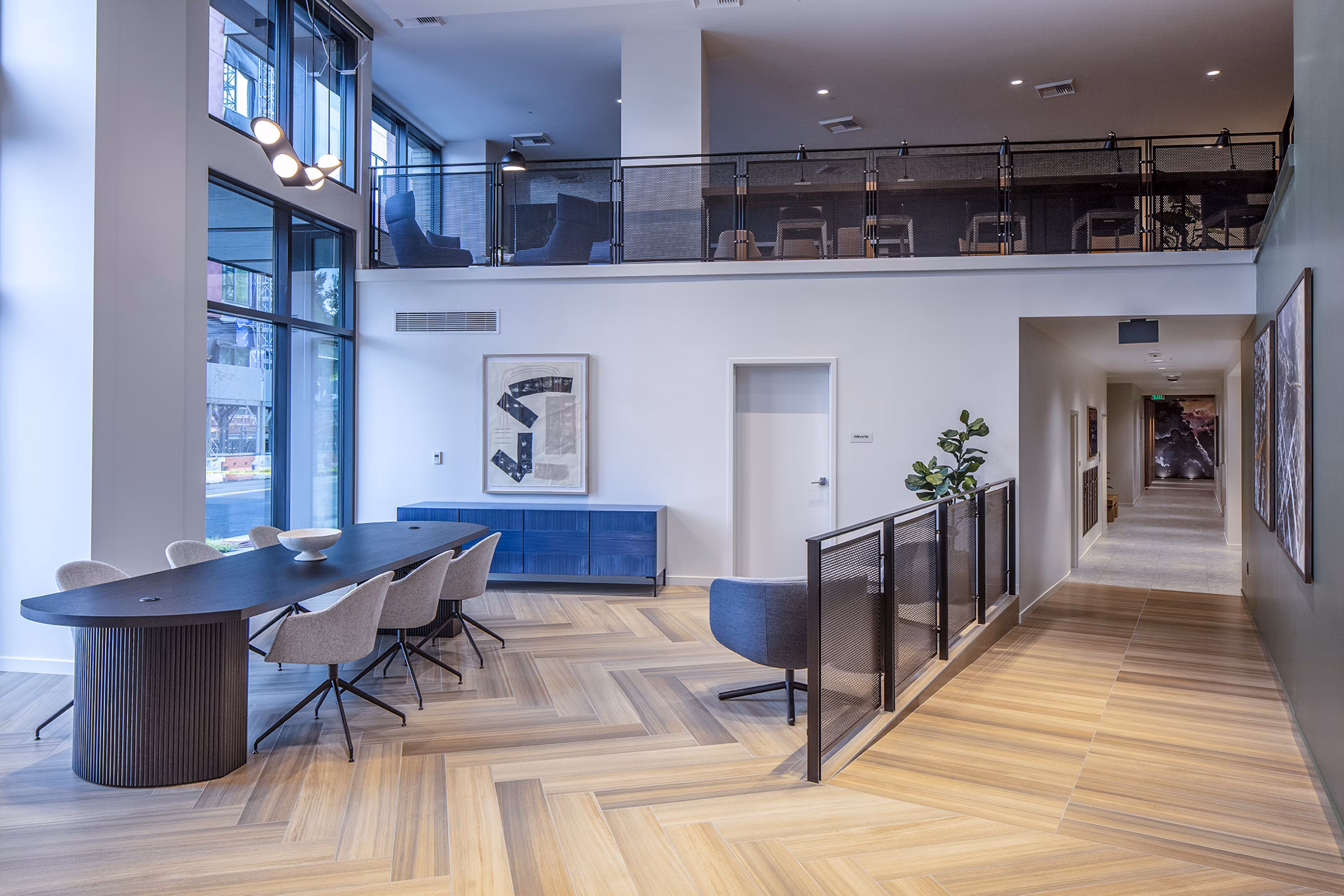 Sawbuck Apartments: Modern clubhouse/lobby with contemporary design and seating areas, ideal for relaxing and socializing