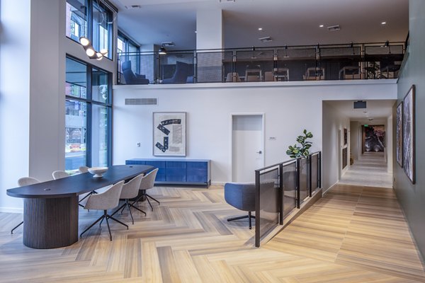 Sawbuck Apartments: Modern clubhouse/lobby with contemporary design and seating areas, ideal for relaxing and socializing