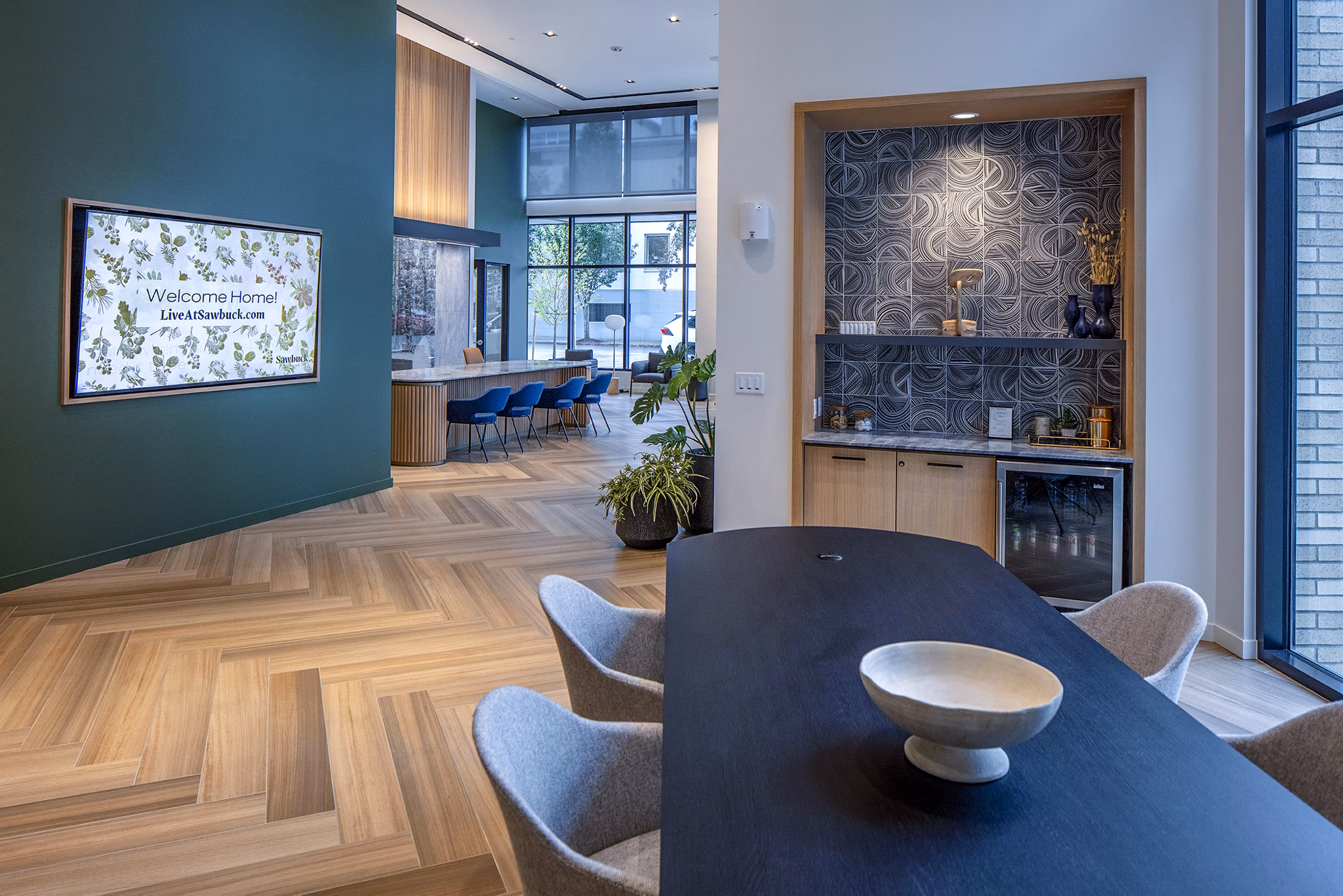 Sawbuck Apartments: Modern clubhouse lobby with contemporary seating area for residents