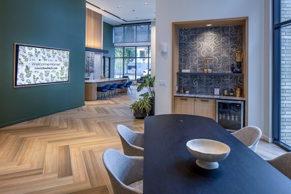 Sawbuck Apartments: Modern clubhouse lobby with contemporary seating area for residents
