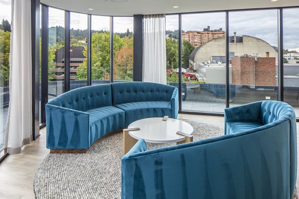 Modern clubhouse featuring lounge and game area at Sawbuck Apartments, a Greystar luxury community