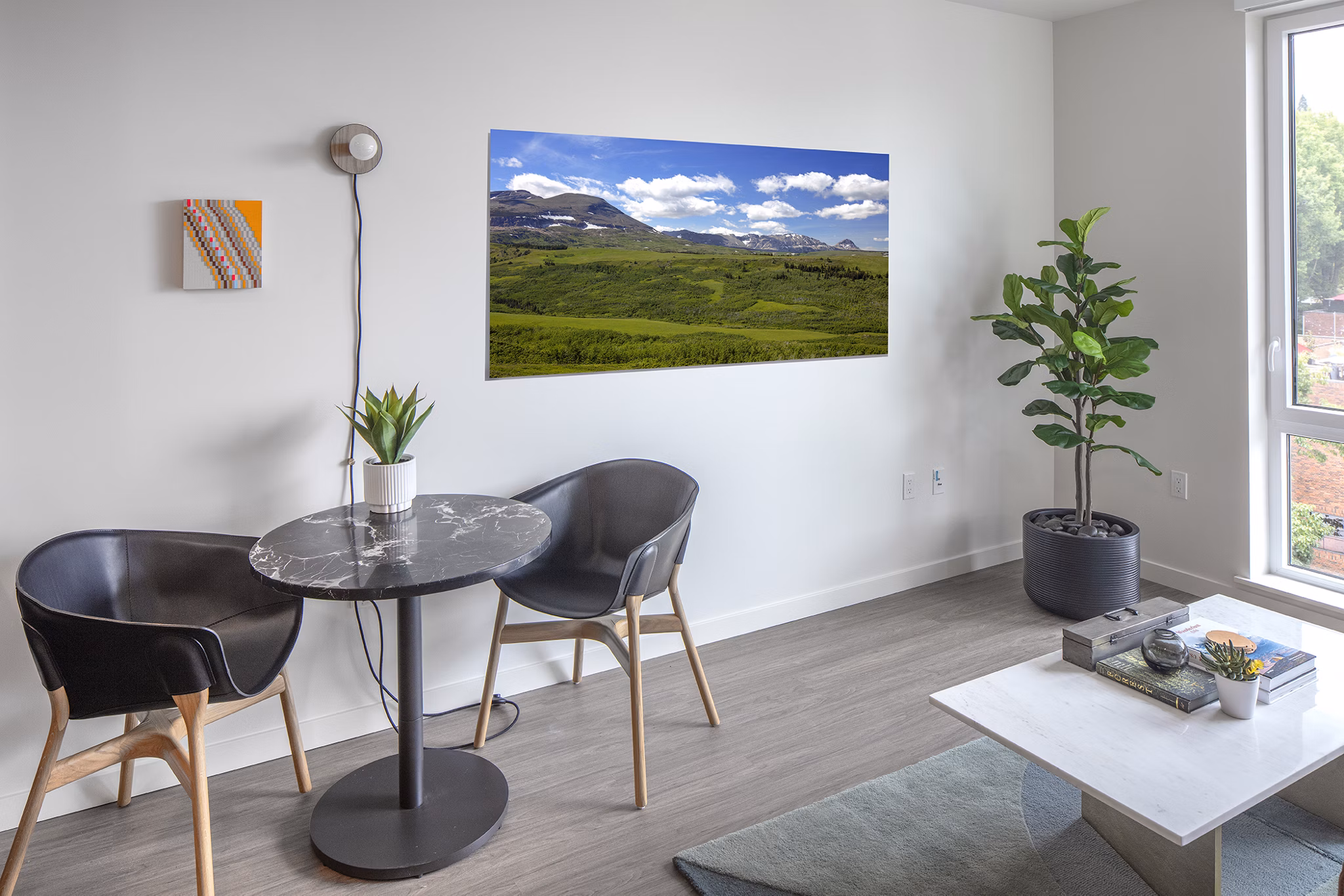 Sawbuck Apartments: Modern dining area featuring elegant decor and ample natural light