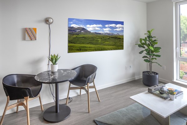 Sawbuck Apartments: Modern dining area featuring elegant decor and ample natural light