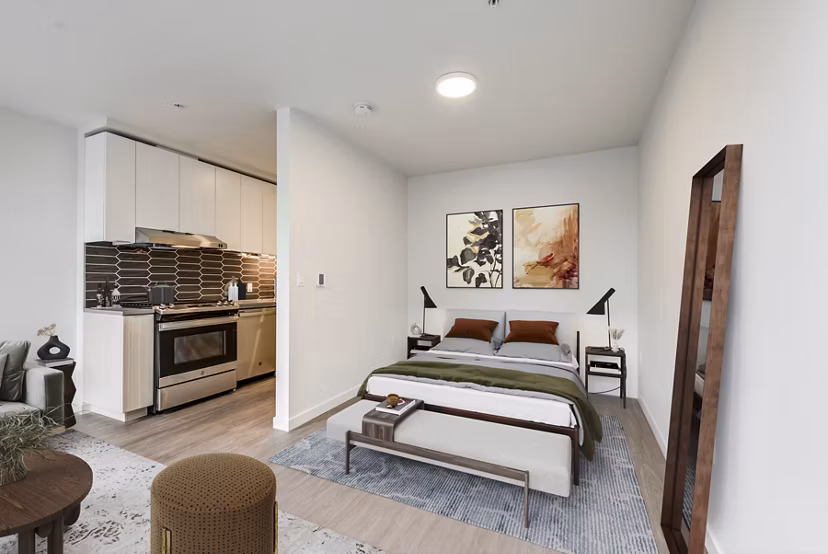 Modern kitchen with stainless steel appliances in Sawbuck Apartments