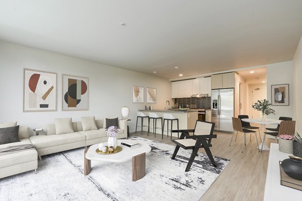 Comfortable living room with modern furnishings at Sawbuck Apartments