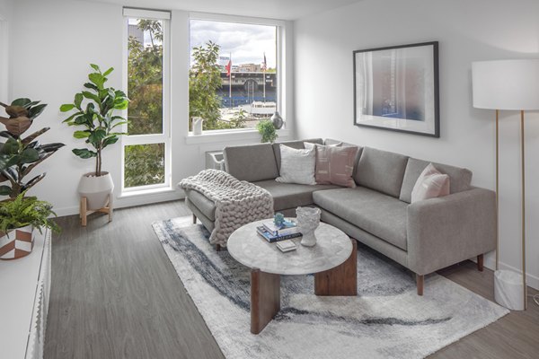 Spacious living room with modern decor at Sawbuck Apartments