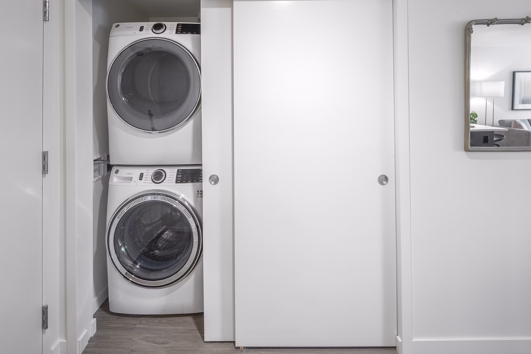 Laundry room featuring state-of-the-art washers and dryers at Sawbuck Apartments
