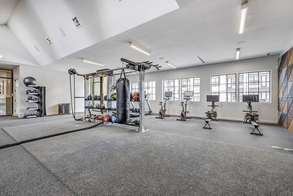 Modern fitness center with advanced equipment at Laurel Apartment Homes, offering a luxurious workout space for residents