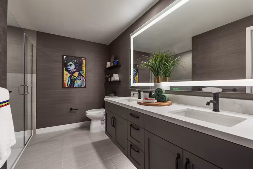 Modern bathroom with sleek fixtures and marble countertops at Mode Apartments