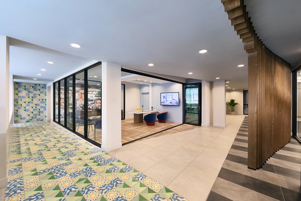 Modern clubhouse featuring stylish seating and billiards at Mode Apartments