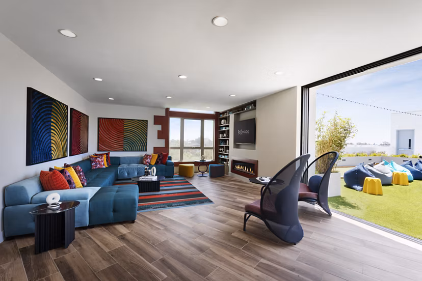 Modern clubhouse with sleek design at Mode Apartments, a Greystar luxury property in vibrant community setting