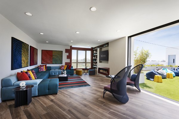 Modern clubhouse with sleek design at Mode Apartments, a Greystar luxury property in vibrant community setting