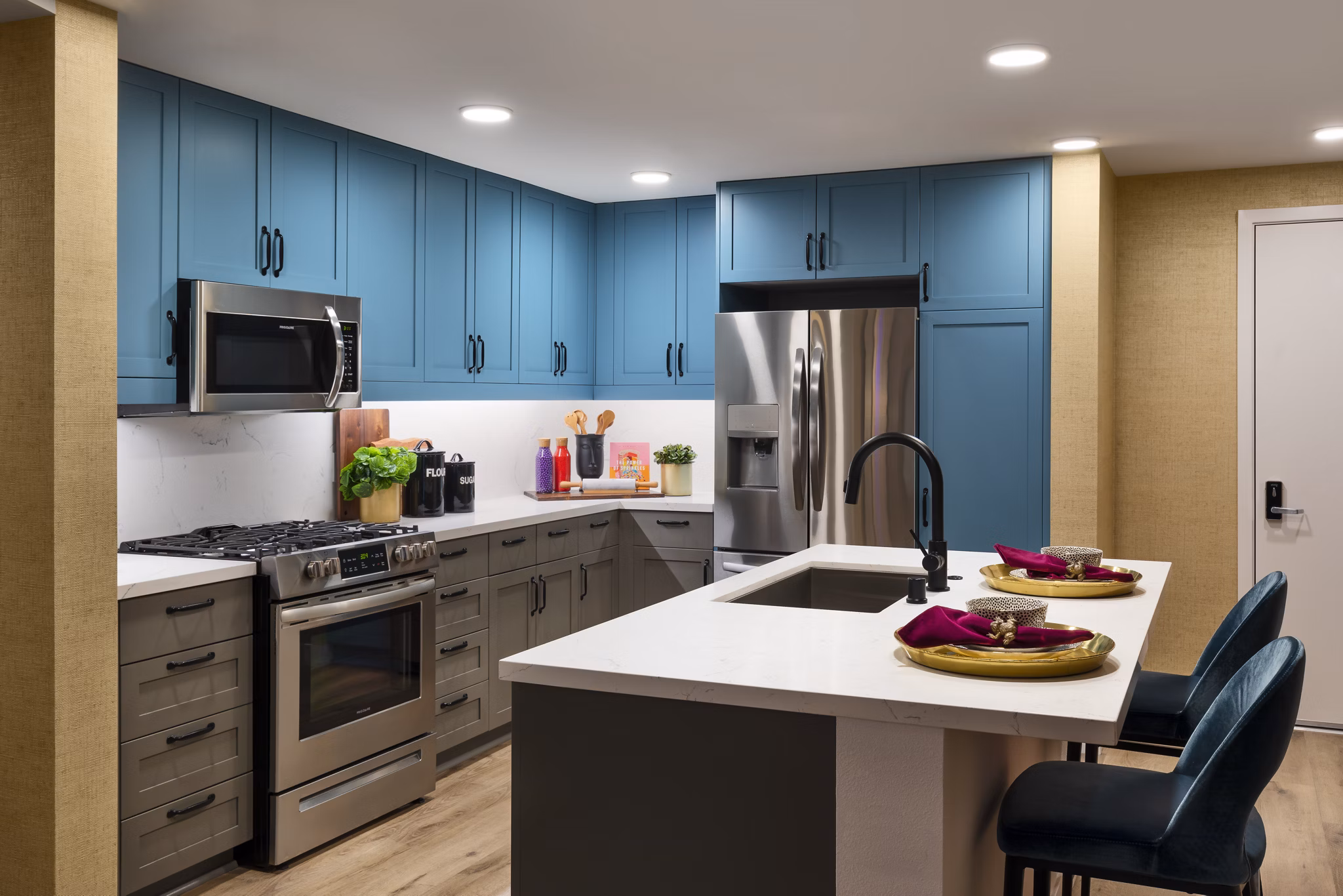 Modern kitchen with stainless steel appliances at Mode Apartments