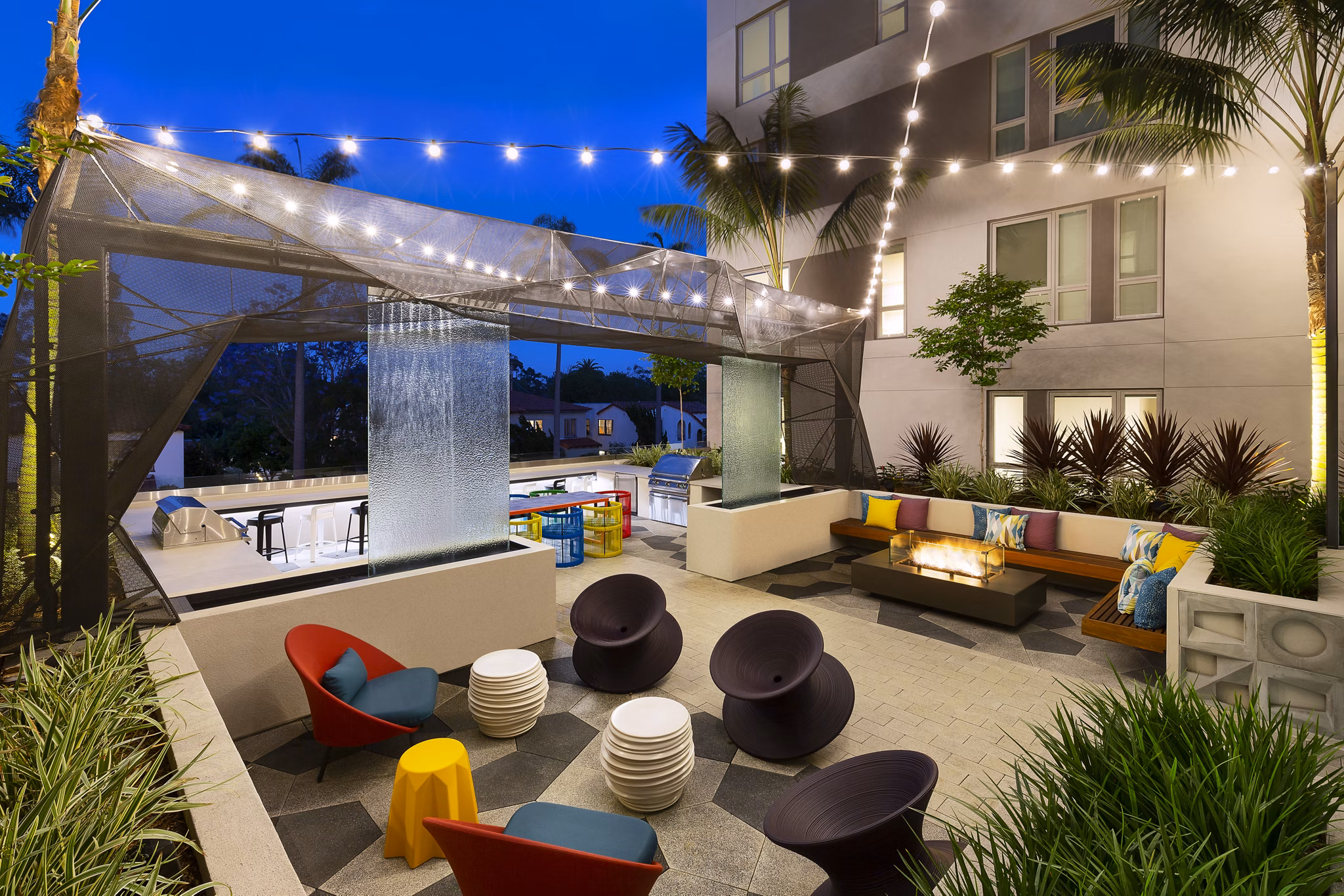 Courtyard with lush landscaping and seating areas at Mode Apartments, a Greystar luxury community